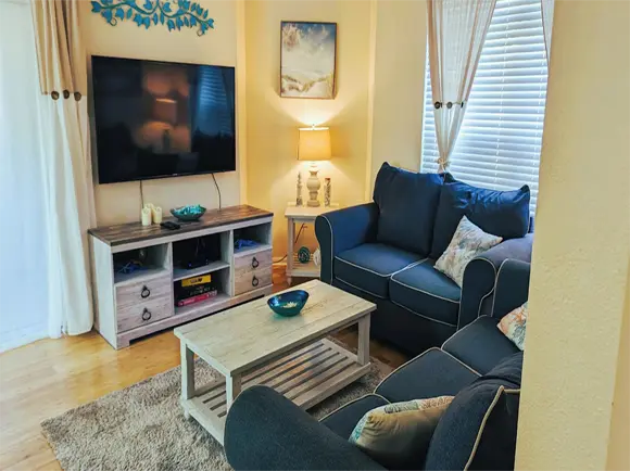 apartment condo living room clearwater tampa bay florida avalon beach sandy toes vacation st-pete st-petersburg bedroom vrbo airbnb amenities luxury sandy toes